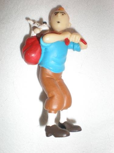 Figurine Tintin,  transportant   Milou dans un sac à dos.