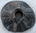 Rouelle tronconique en plomb, cette rouelle possède des signes aux motifs appelés aiguilles d'épicéa.