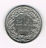 Pièce de 2 Francs argent Suisse émise en 1980 tranche striée. Descriptif. Helvetia, le personnage allégorique féminin suisse, vêtue d'une toge, tient une lance.