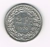 Pièce de 2 Francs argent Suisse émise en 1970 tranche striée. Descriptif. Helvetia, le personnage allégorique féminin suisse, vêtue d'une toge, tient une lance.
