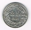 Pièce de 2 Francs argent Suisse émise en 1943 tranche striée. Descriptif. Helvetia, le personnage allégorique féminin suisse, vêtue d'une toge, tient une lance.